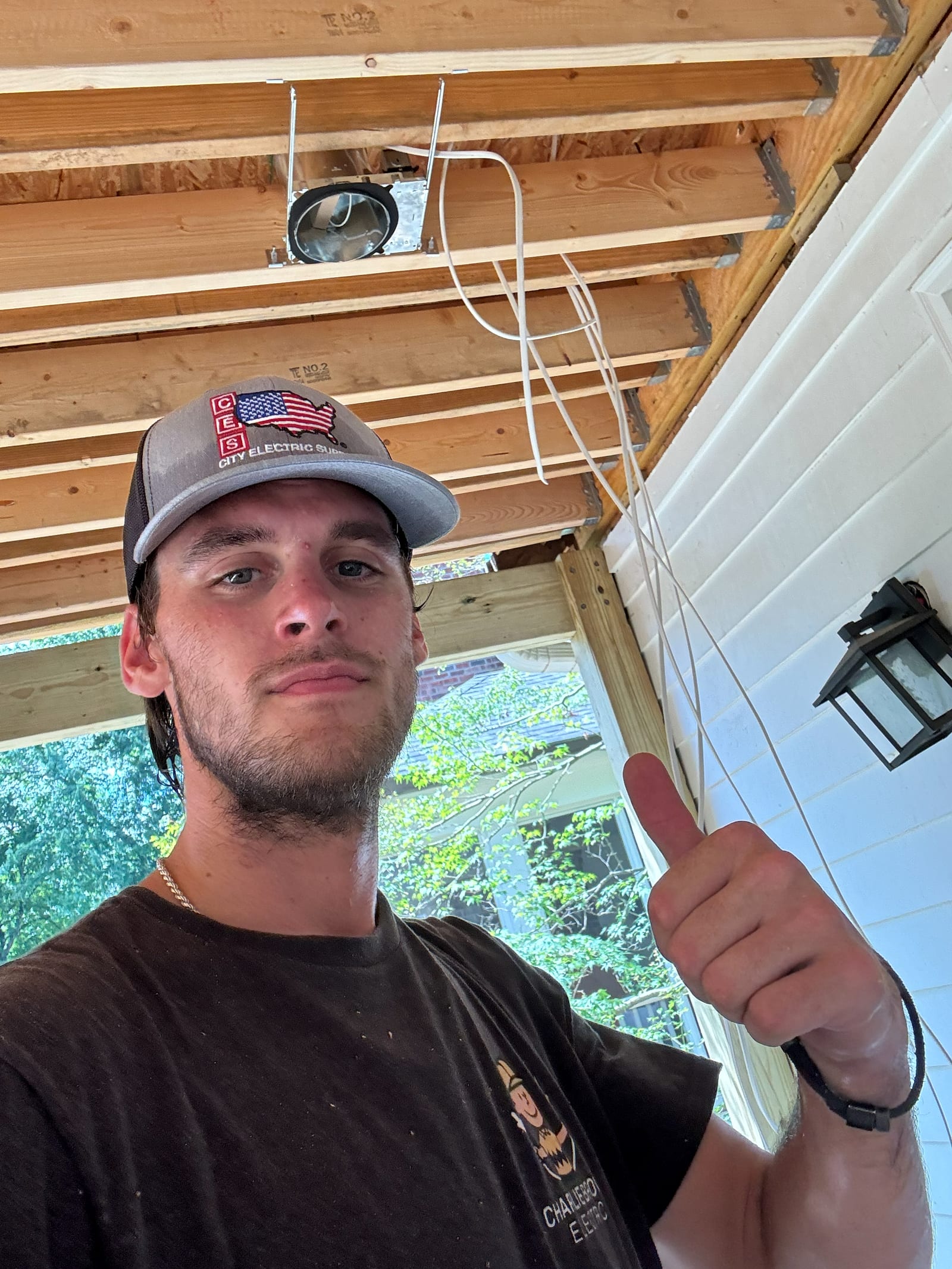 Charlie McCloskey, owner of Charlie Brown Electric, on site at a porch addition where he has just installed a recessed light